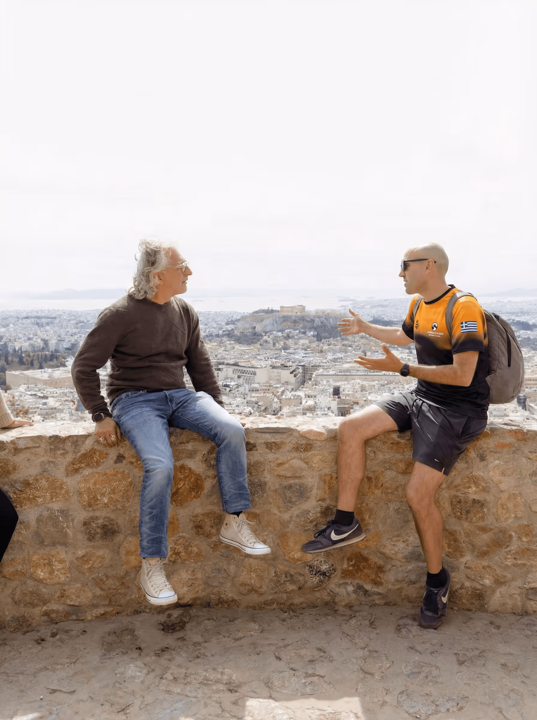 Small group watching sunrise from Lycabettus Hill summit on an Athens walking tour