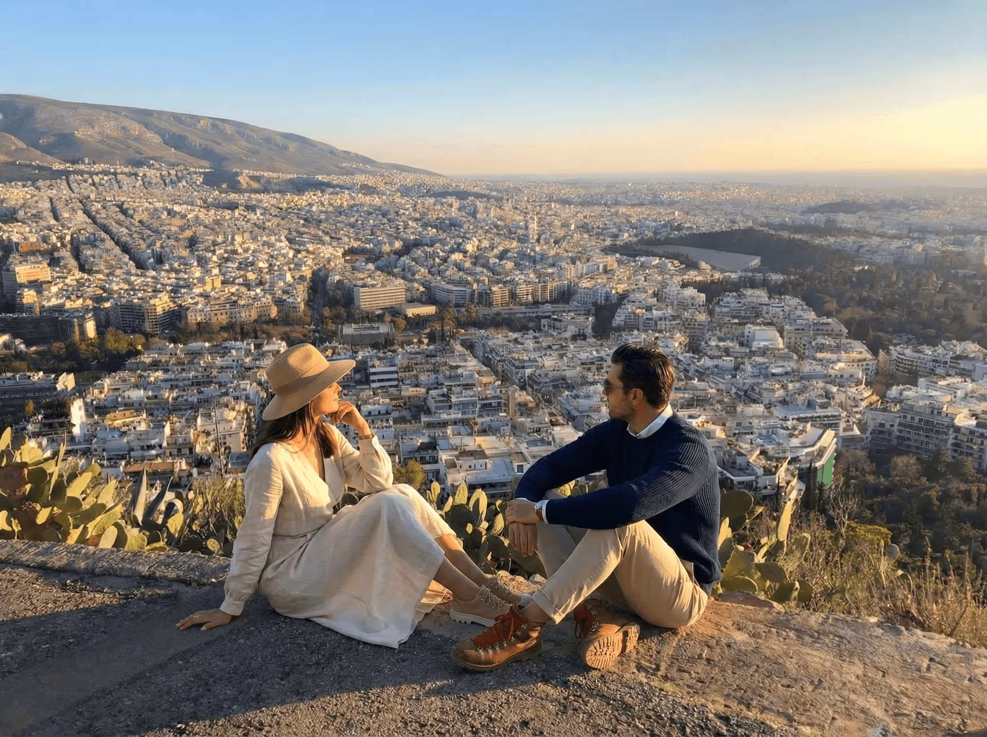 Sunset from Lycabettus Hill with golden light flooding over the Acropolis and Athens